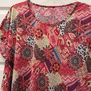 This is a Raindrops by Papillon women's boho print multicolor blouse